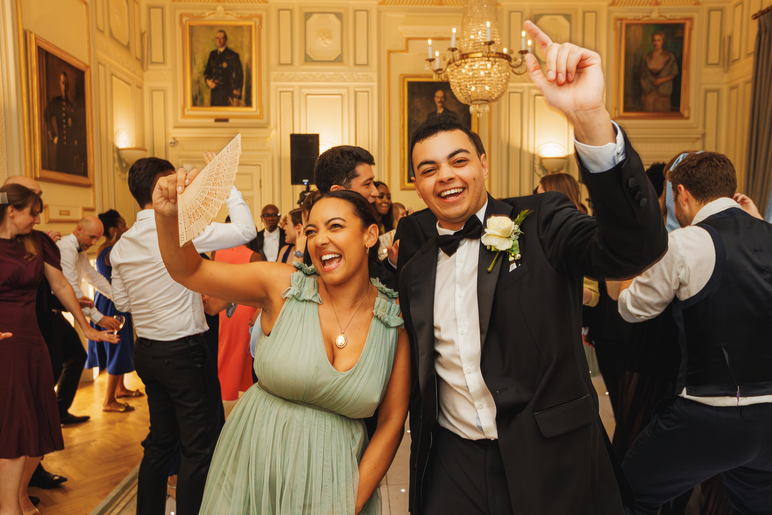 Guests Dancing and Celebrating at the In and Out Club 22 Wedding guests dancing joyfully at the reception held at the In and Out Club